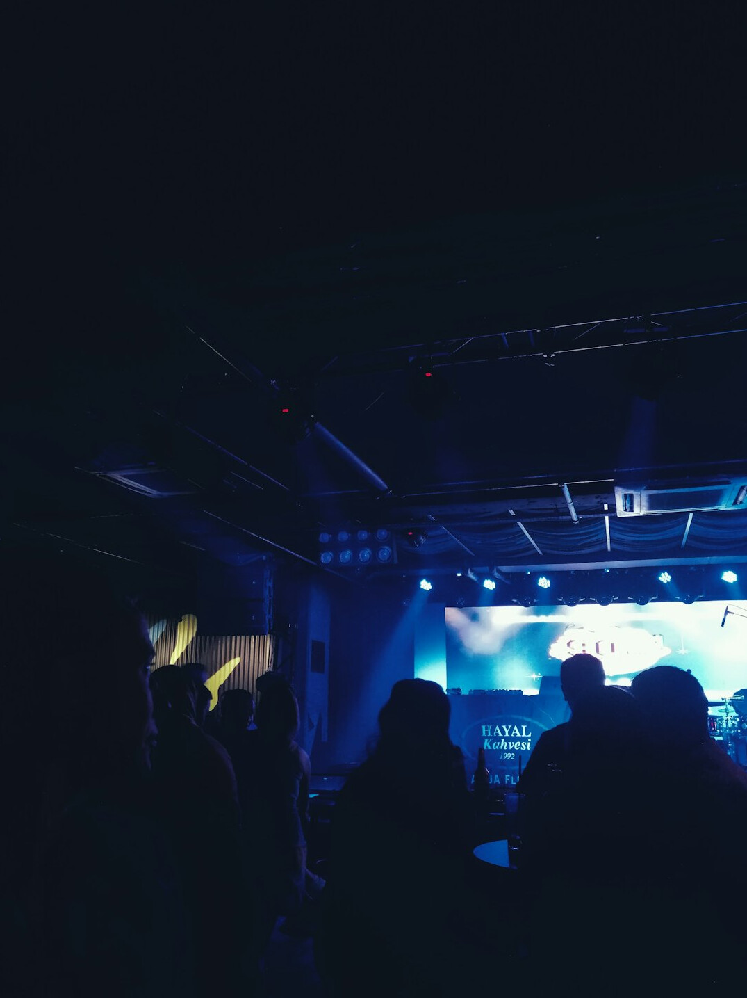 Conference stage with lighting and audience